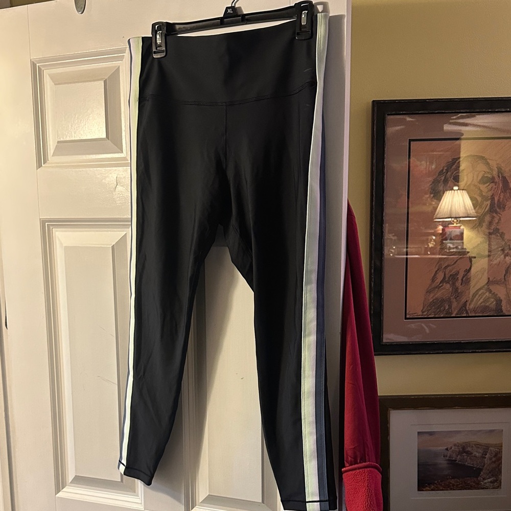 Athleta ladies Black Leggings with White grey and green Stripes